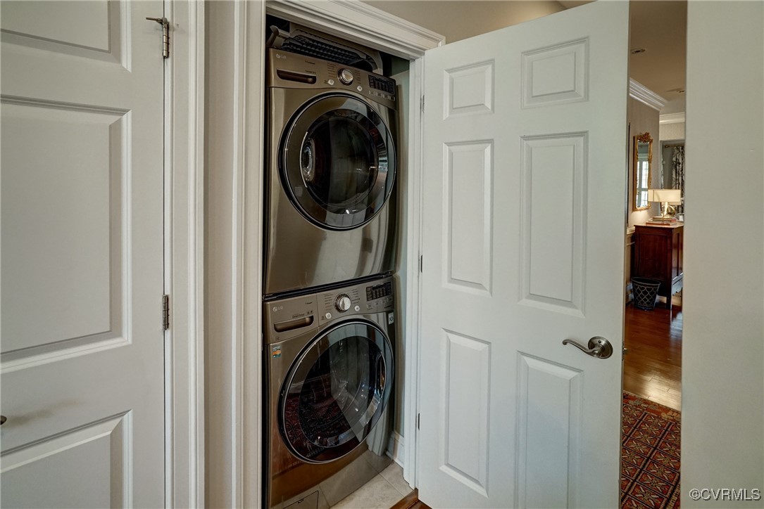 709 Chiswick Park Road Henrico, VA 23229 - Photo 29 of 47 Laundry room featuring stacked washer / dryer, til