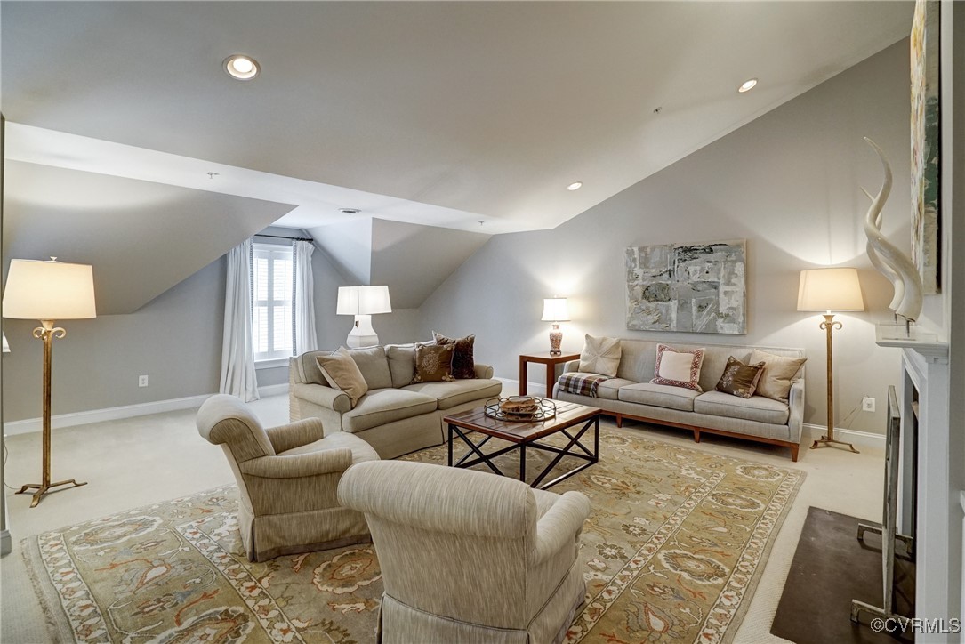 709 Chiswick Park Road Henrico, VA 23229 - Photo 33 of 47 Carpeted living area featuring lofted ceiling and