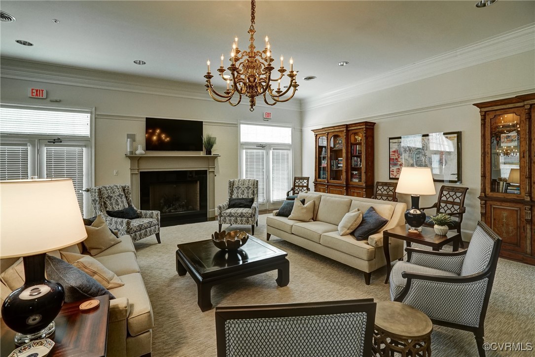 709 Chiswick Park Road Henrico, VA 23229 - Photo 42 of 47 Living area with carpet, a chandelier, a fireplace
