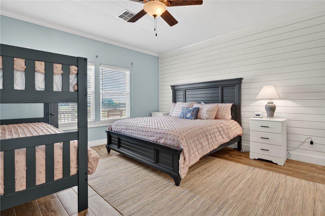 838 Rattlesnake Point Road Rockport, TX 78382 - Photo 22 of 40 a bedroom with a bed and window