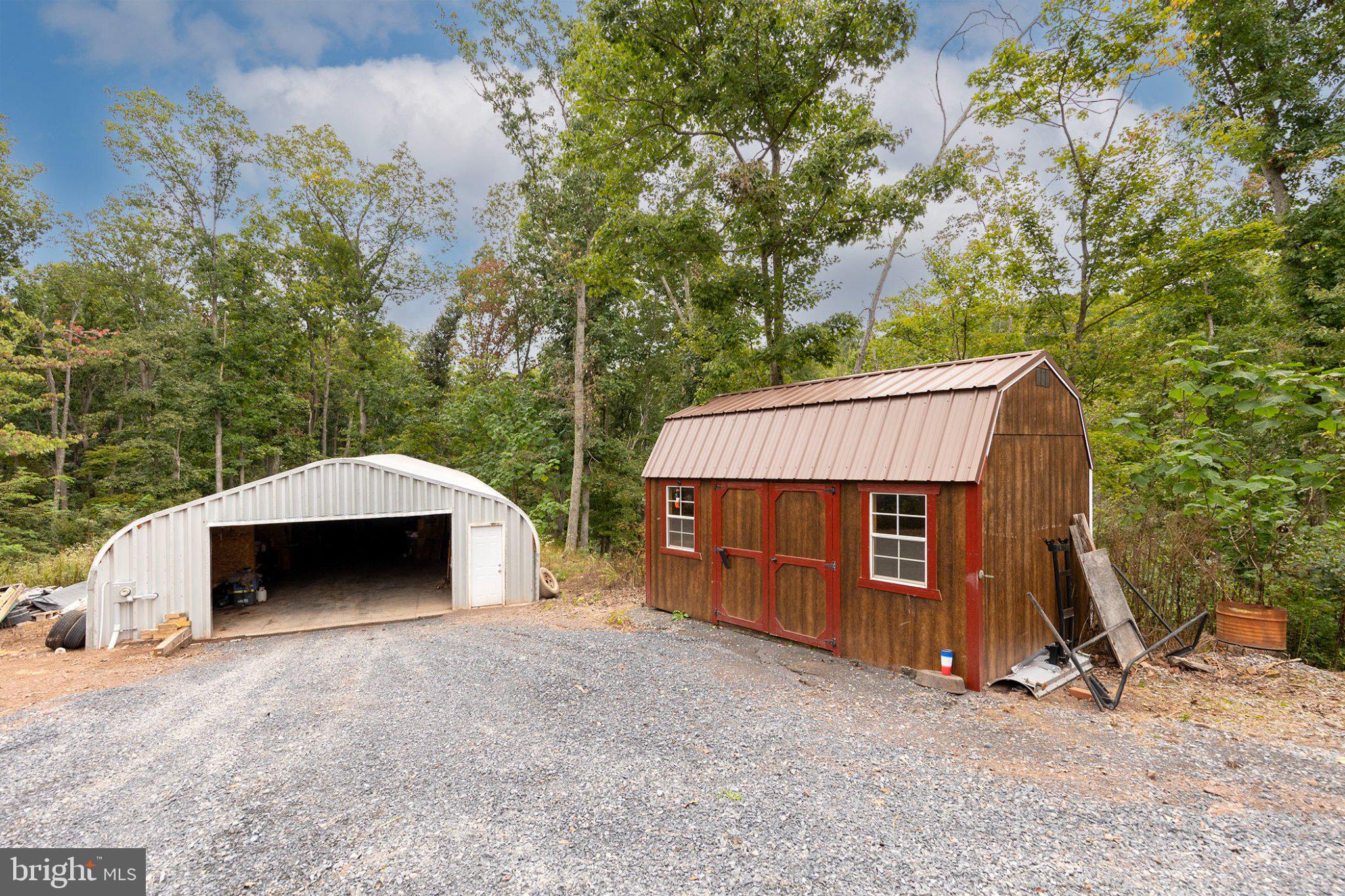 1305 Whispering Pines Road Paw Paw, WV 25434 - Photo 50 of 64 Landscaping Shed beside Workshop/Garage