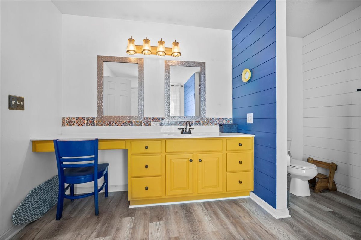 1318 Shannon Road Normal, IL 61761 - Photo 17 of 40 a bathroom with a granite countertop sink a mirror and a bathtub