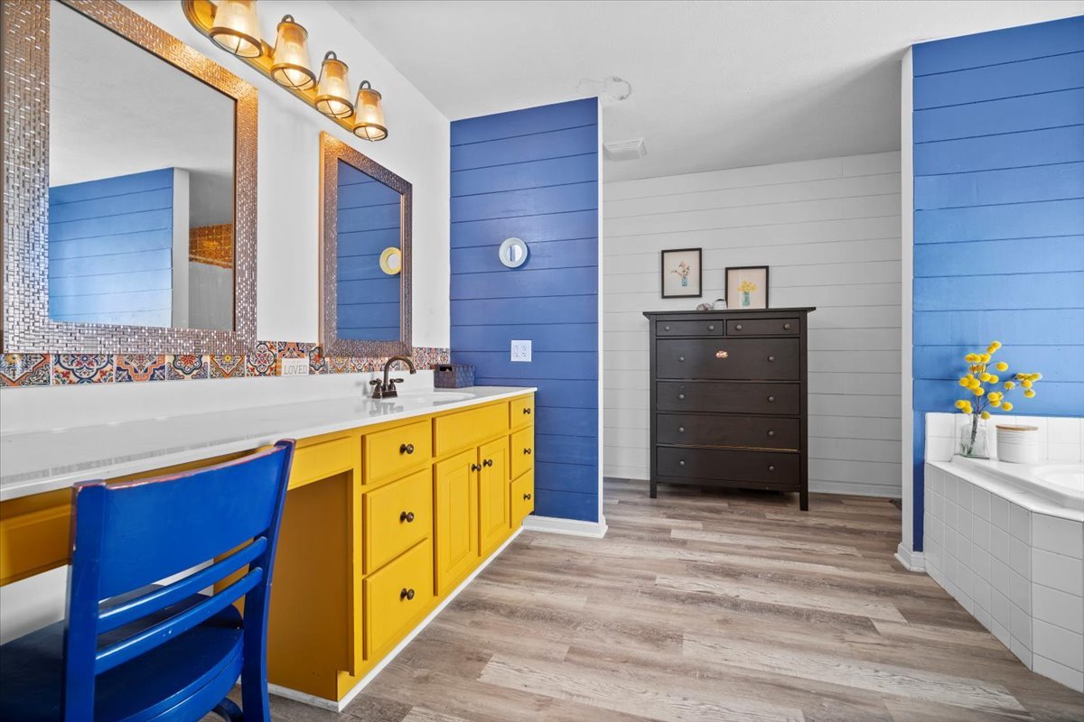 1318 Shannon Road Normal, IL 61761 - Photo 18 of 40 a spacious bathroom with a granite countertop sink and a bathtub