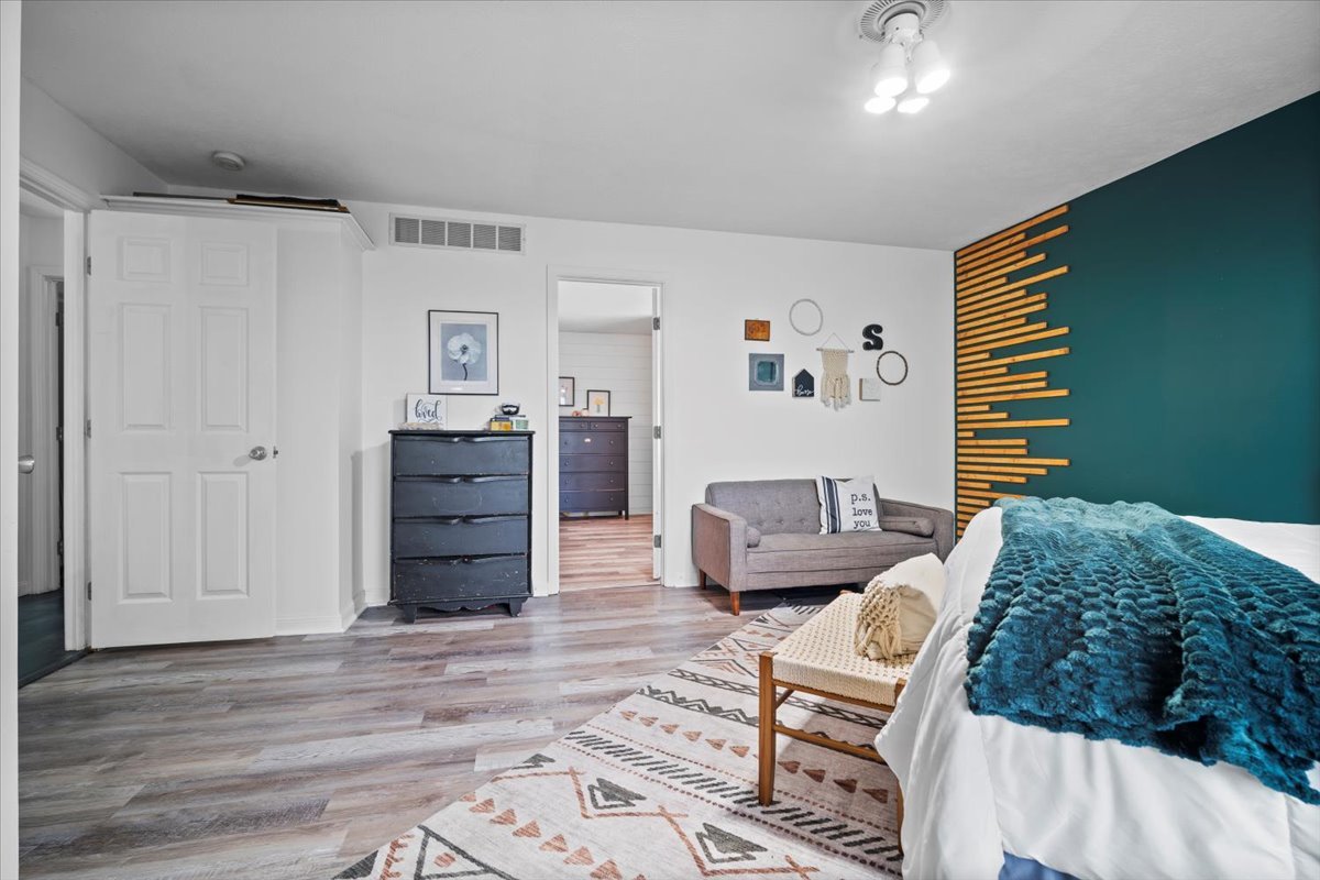 1318 Shannon Road Normal, IL 61761 - Photo 19 of 40 a bedroom with furniture and wooden floor