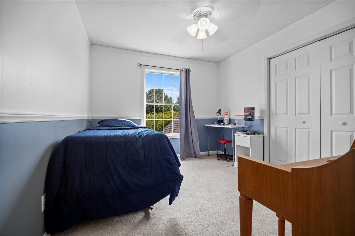 1318 Shannon Road Normal, IL 61761 - Photo 22 of 40 a bedroom with a bed and a window