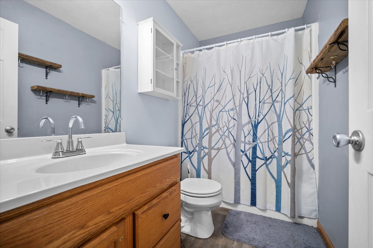 1318 Shannon Road Normal, IL 61761 - Photo 26 of 40 a bathroom with a toilet sink and mirror