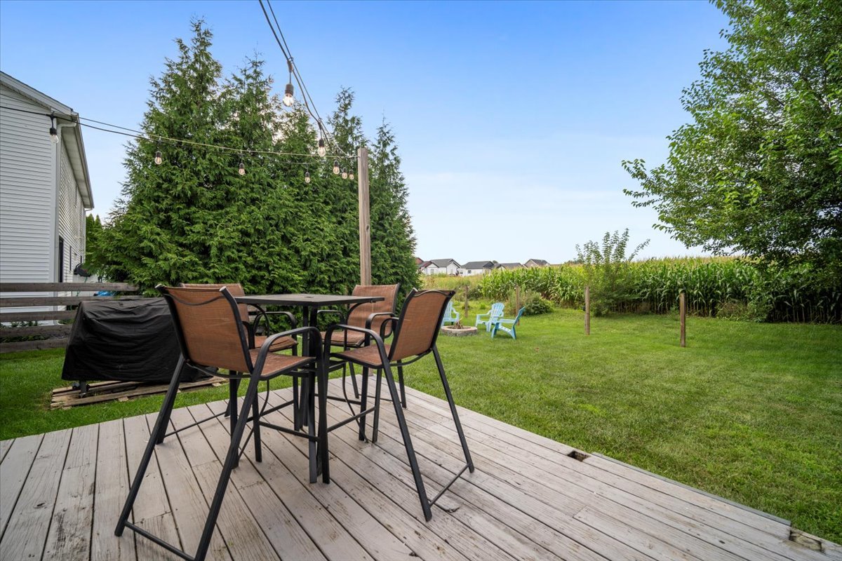 1318 Shannon Road Normal, IL 61761 - Photo 33 of 40 a view of a chairs and table on the wooden deck