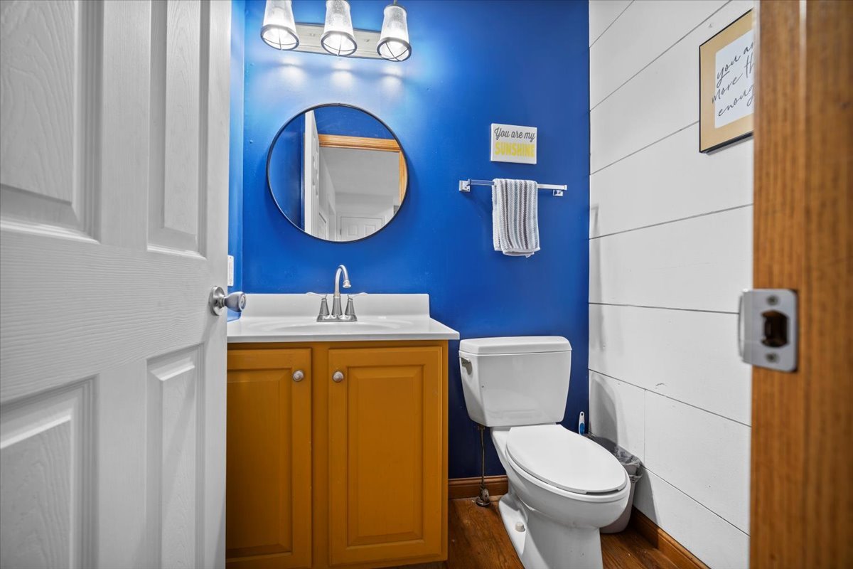 1318 Shannon Road Normal, IL 61761 - Photo 7 of 40 a bathroom with a toilet and a mirror