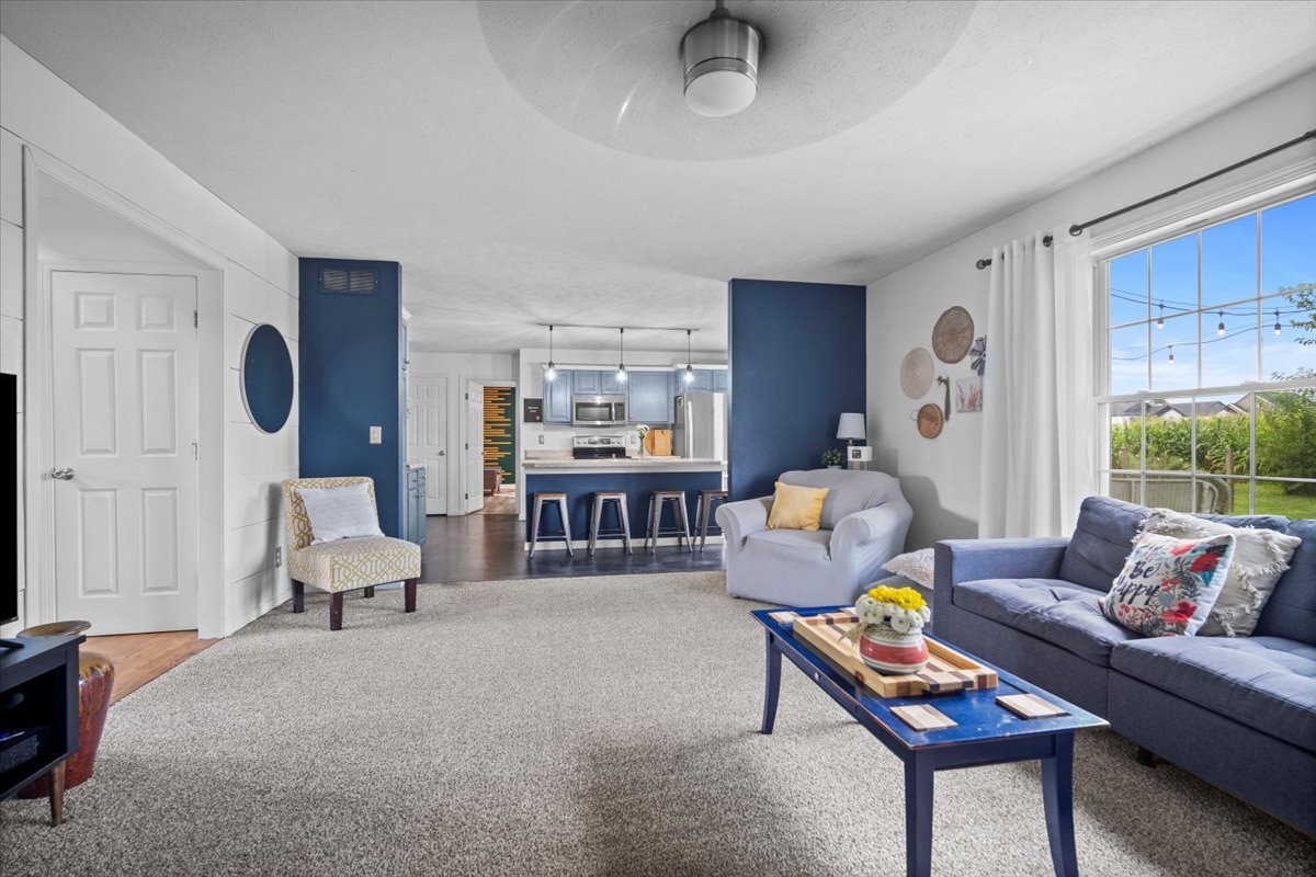 1318 Shannon Road Normal, IL 61761 - Photo 9 of 40 a living room with furniture and a couch