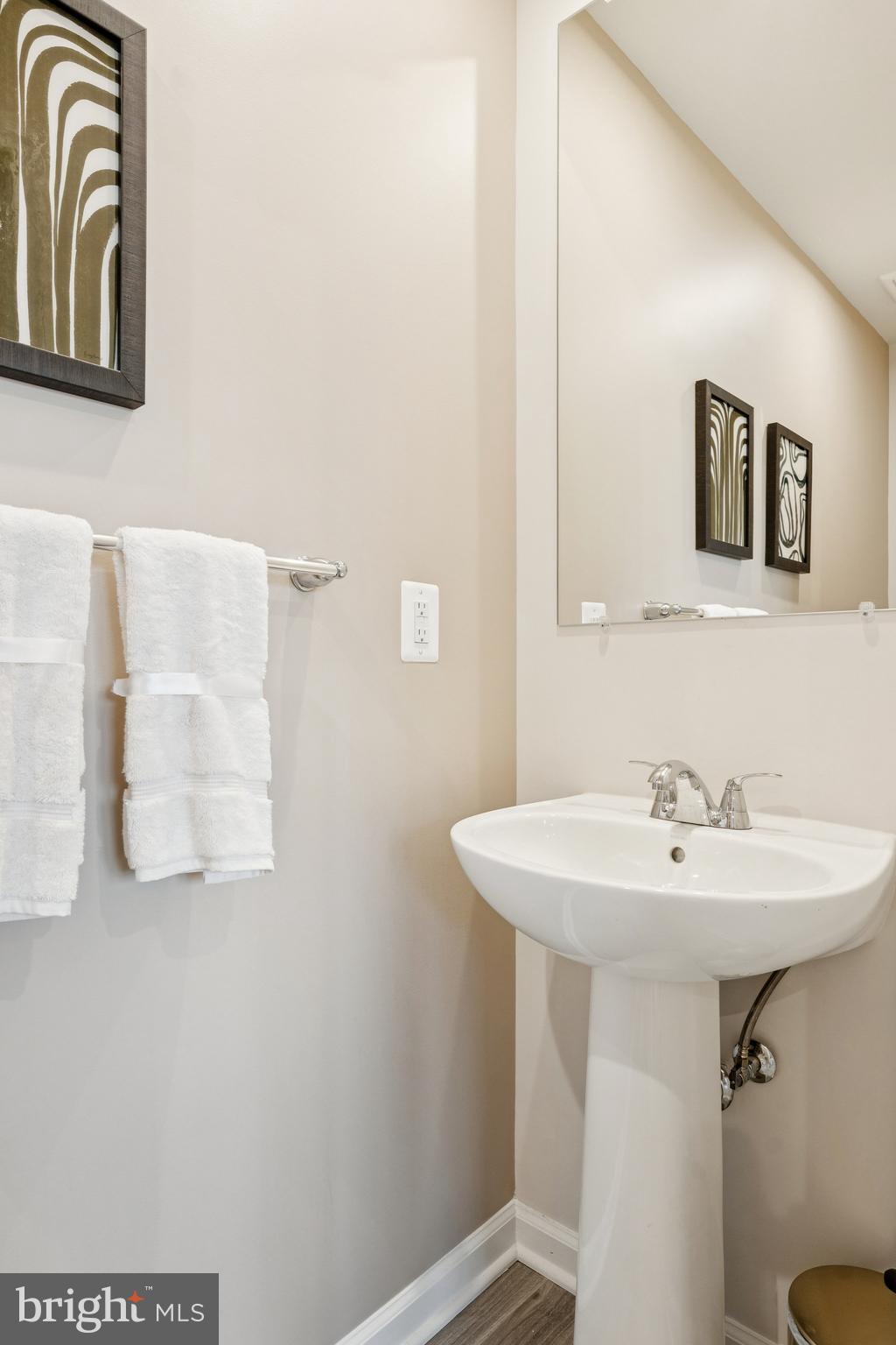 1925 Barolo Boulevard Hanover, MD 21076 - Photo 21 of 37 a bathroom with a sink and mirror