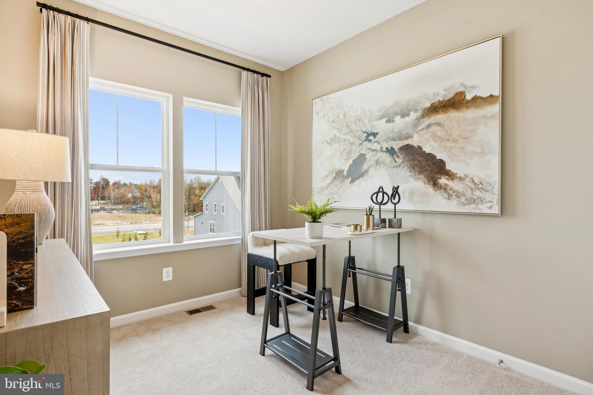 1925 Barolo Boulevard Hanover, MD 21076 - Photo 23 of 37 a view of a workspace with furniture and a window