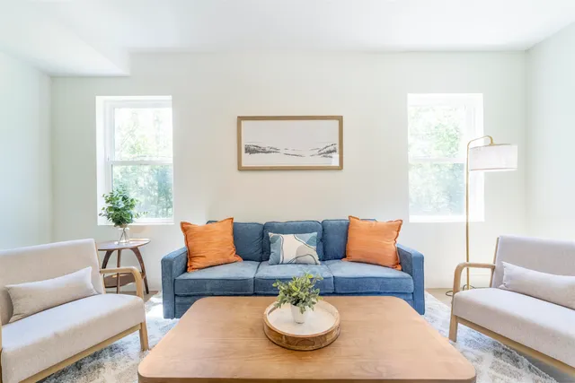 a kitchen with a refrigerator and a stove top oven
