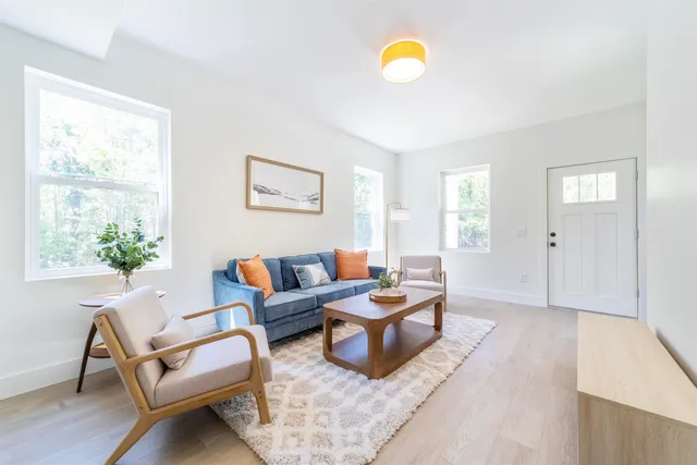 a kitchen with a stove a sink and a refrigerator