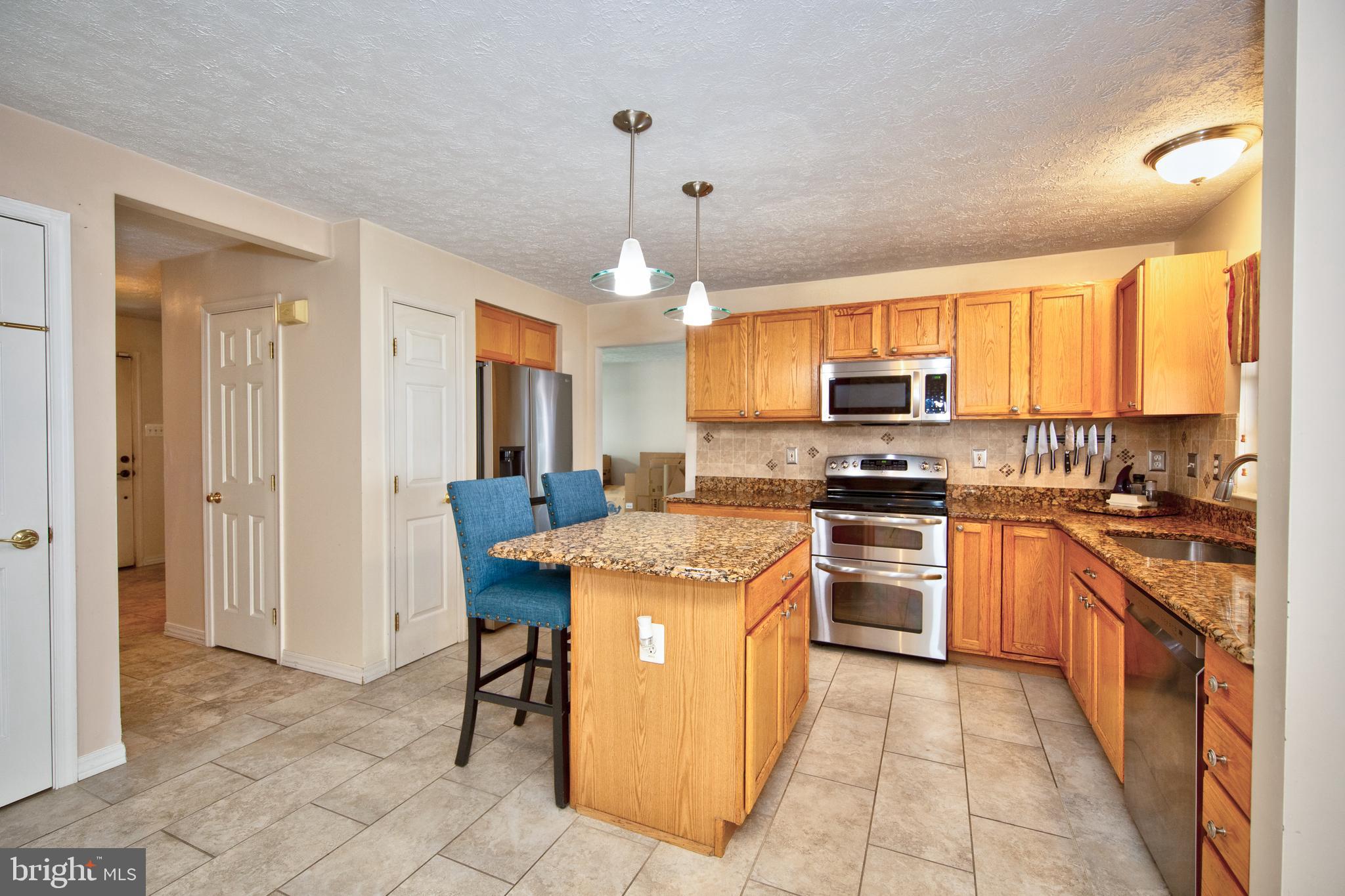 307 Powdersby Road Joppa, MD 21085 - Photo 15 of 45 Kitchen with granite counters & SS appliances