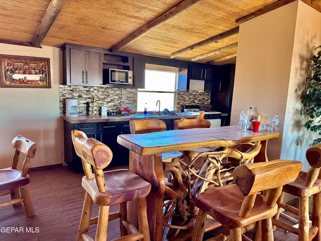 a dining room with furniture and window
