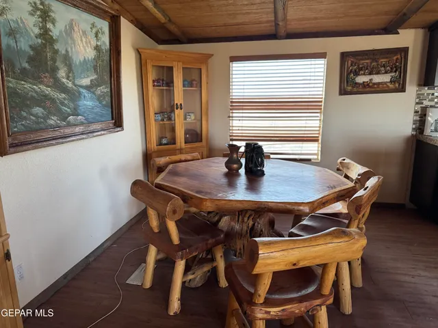 a dining room with furniture and window