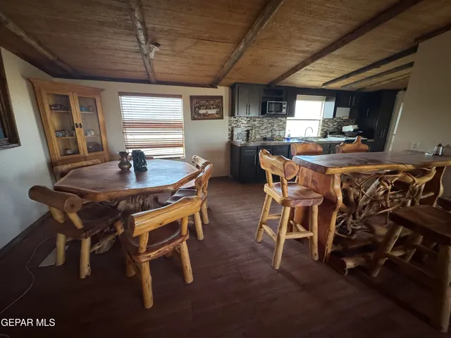 a dining room with furniture and window