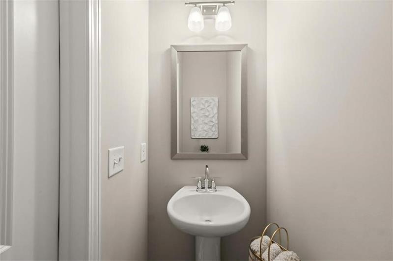 20006 Windalier Way Roswell, GA 30076 - Photo 21 of 58 a bathroom with a sink and a mirror