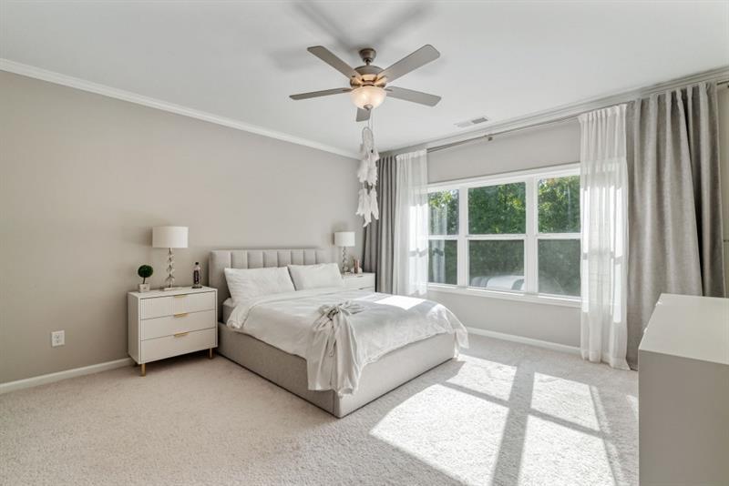 20006 Windalier Way Roswell, GA 30076 - Photo 24 of 58 a spacious bedroom with a bed and a large window