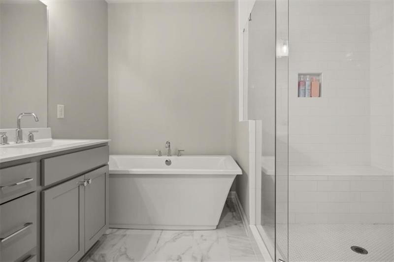 20006 Windalier Way Roswell, GA 30076 - Photo 27 of 58 a bathroom with a sink and a bathtub