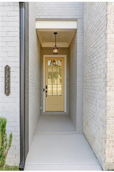 20006 Windalier Way Roswell, GA 30076 - Photo 4 of 58 a view of a hallway to windows and yard