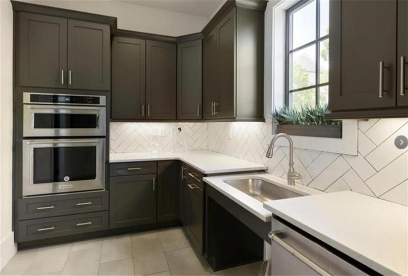 20006 Windalier Way Roswell, GA 30076 - Photo 43 of 58 a kitchen with a sink and an oven