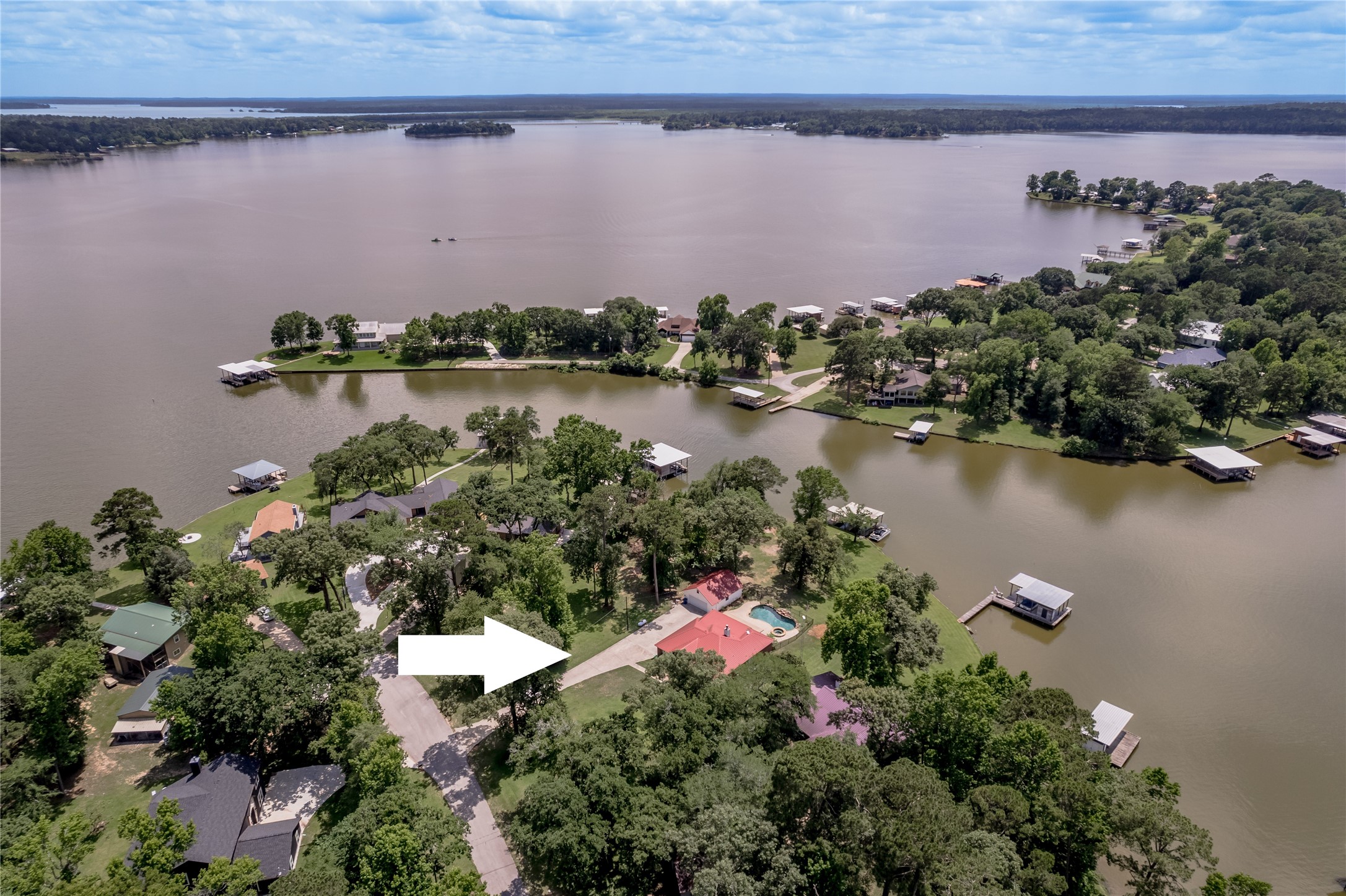 324 Red Oak Lane Trinity, TX 75862 - Photo 1 of 49 an aerial view of a house with a lake view