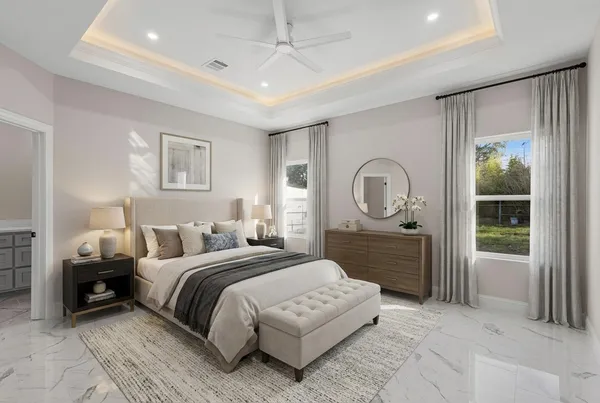 a bedroom with a large bed and a dresser