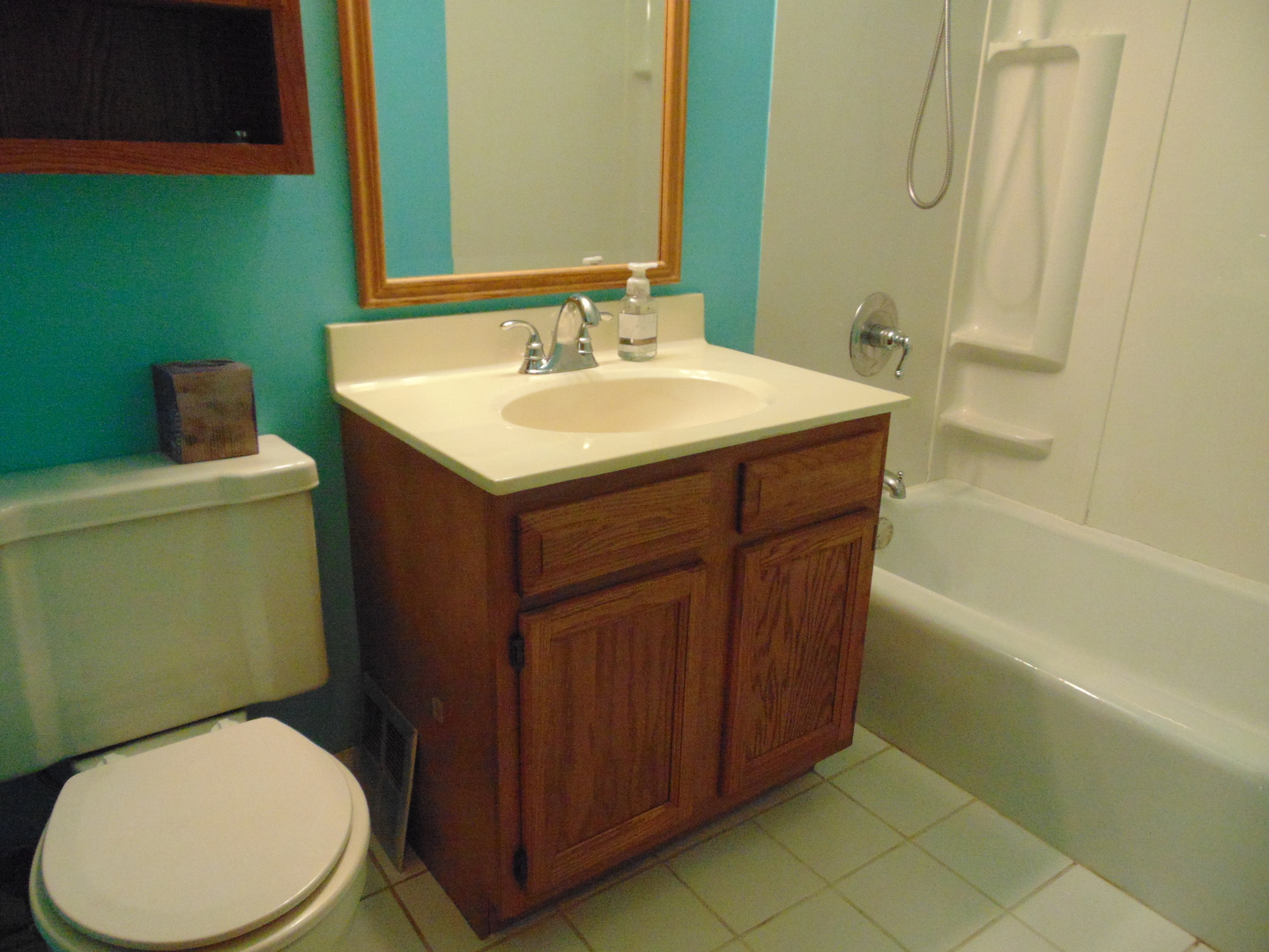 10428 Ridgeland Avenue, Unit 6 Chicago Ridge, IL 60415 - Photo 10 of 11 a bathroom with a sink mirror vanity and toilet