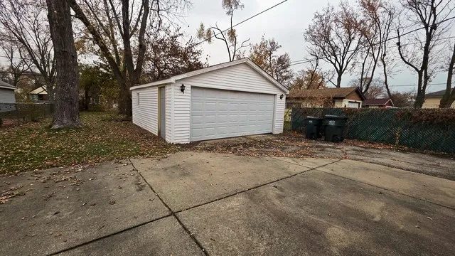 a view of a house with a yard and garage
