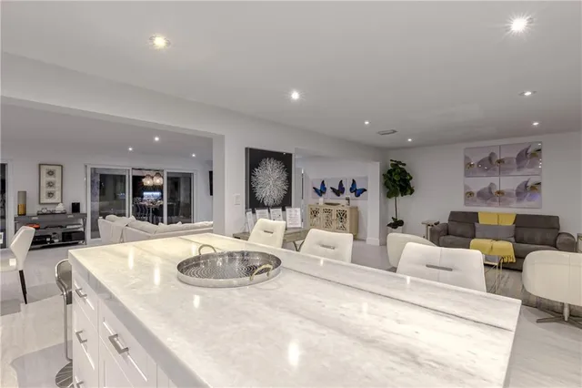 a living room with furniture or couch and a dining table