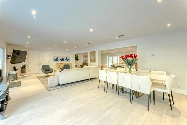 a spacious bathroom with a double vanity sink mirror and toilet
