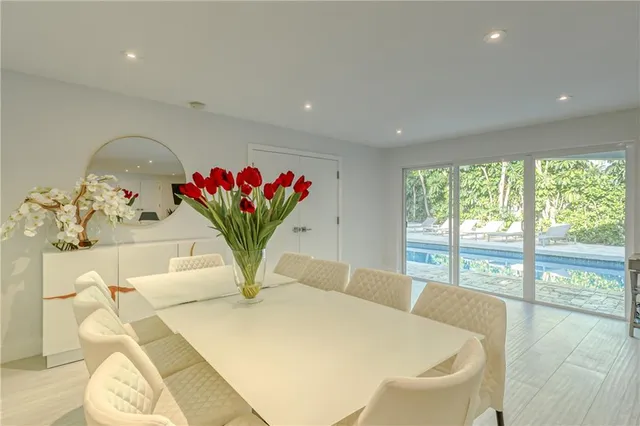 a spacious bedroom with a large bed and a flat screen tv