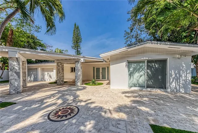a utility room with cabinets washer and dryer