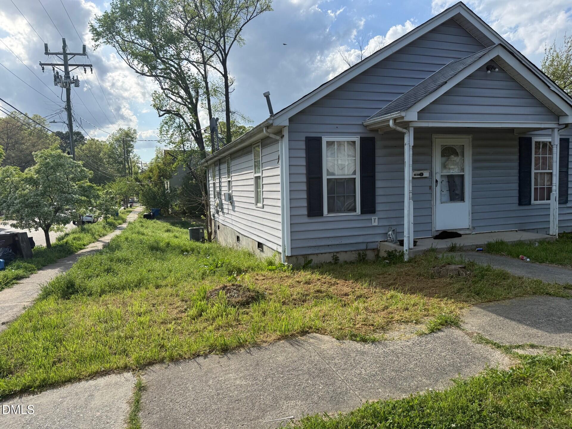 1001 Berkeley Street Durham, NC 27705 - Photo 2 of 3 a view of house with a yard