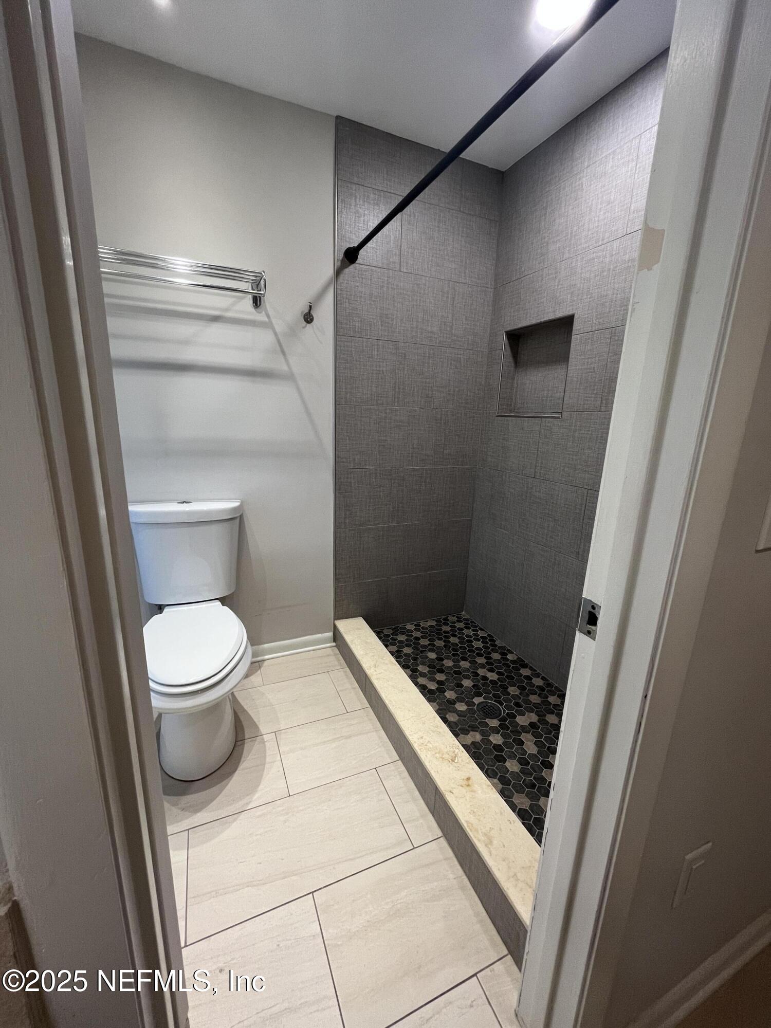 1809 Kings Way Neptune Beach, FL 32266 - Photo 17 of 28 a bathroom with a toilet and a shower