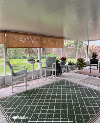 a outdoor space with lots of white furniture