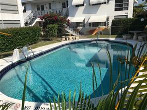 3720 Harrison Street, Unit 3 Hollywood, FL 33021 - Photo 2 of 8 a view of swimming pool from a balcony