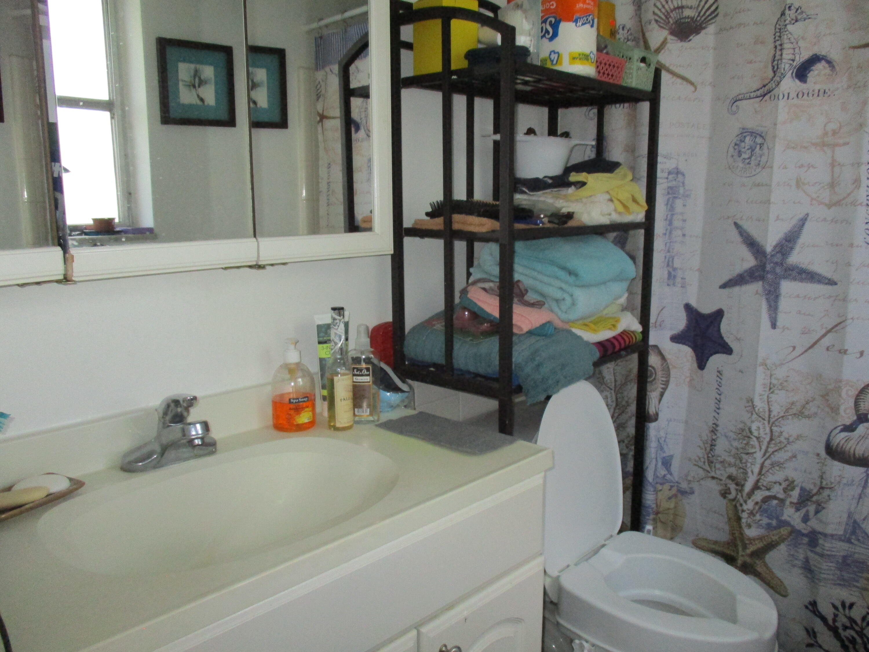3720 Harrison Street, Unit 3 Hollywood, FL 33021 - Photo 8 of 8 a bathroom with a sink and a toilet
