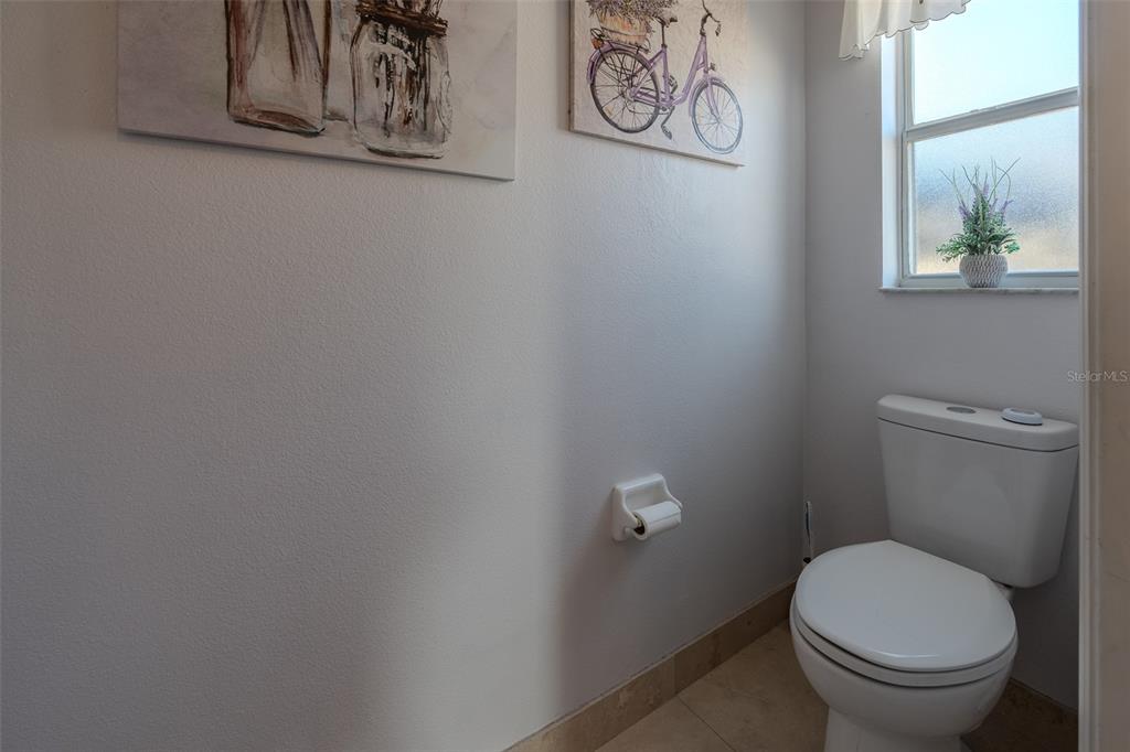 15143 Southwest 14th Avenue Road Ocala, FL 34473 - Photo 23 of 53 a white toilet sitting next to a window