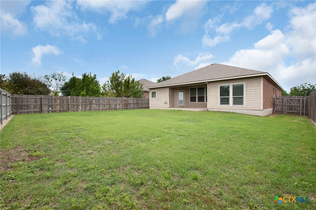 408 Copper Ridge Loop Temple, TX 76502 - Photo 35 of 39 Private fenced backyard featuring a covered patio