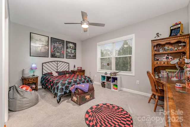 a bedroom with furniture and a window