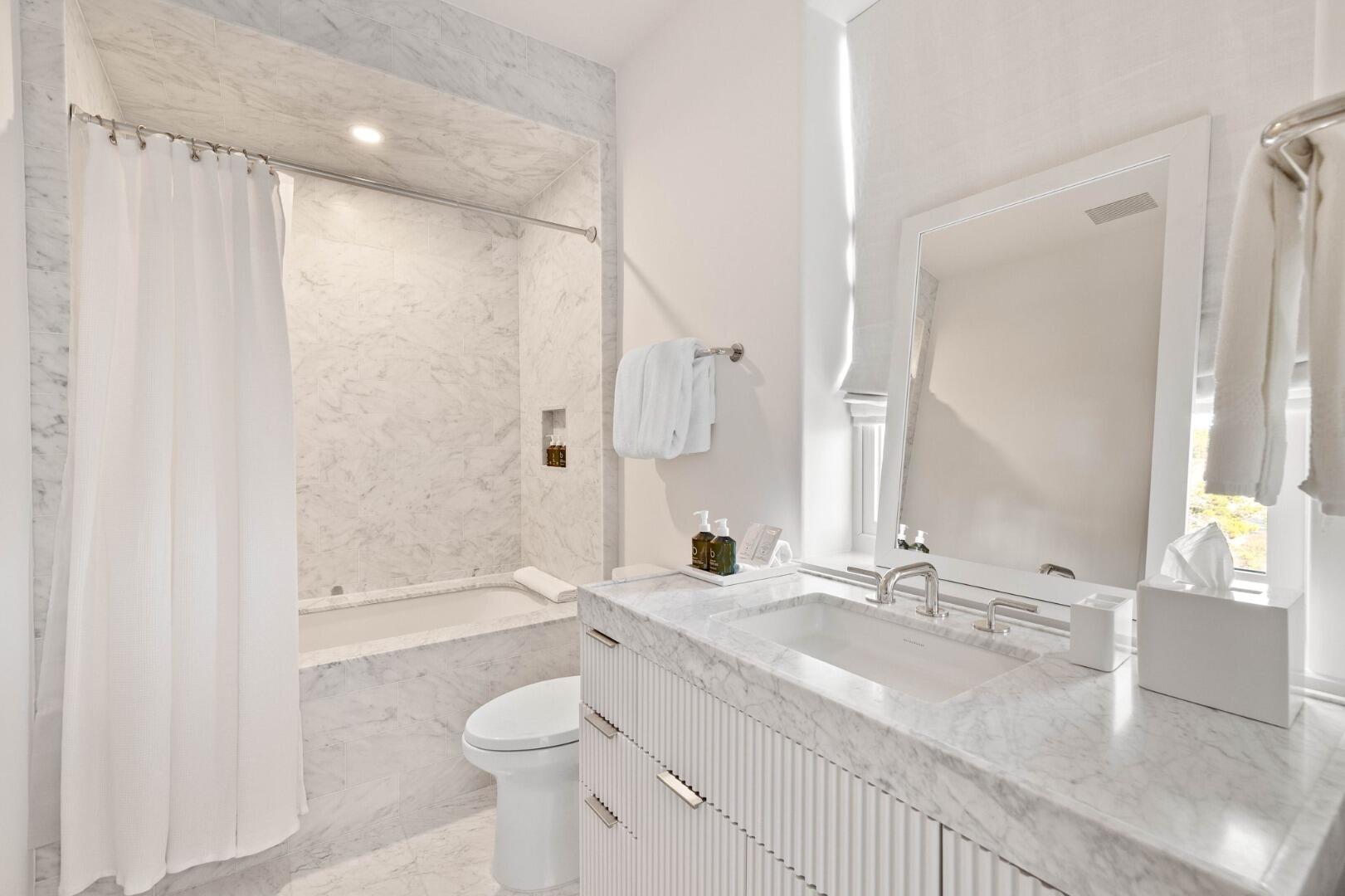 45 West Solaire Way Inlet Beach, Unit 308 Inlet Beach, FL 32461 - Photo 7 of 10 a bathroom with a granite countertop sink toilet and shower