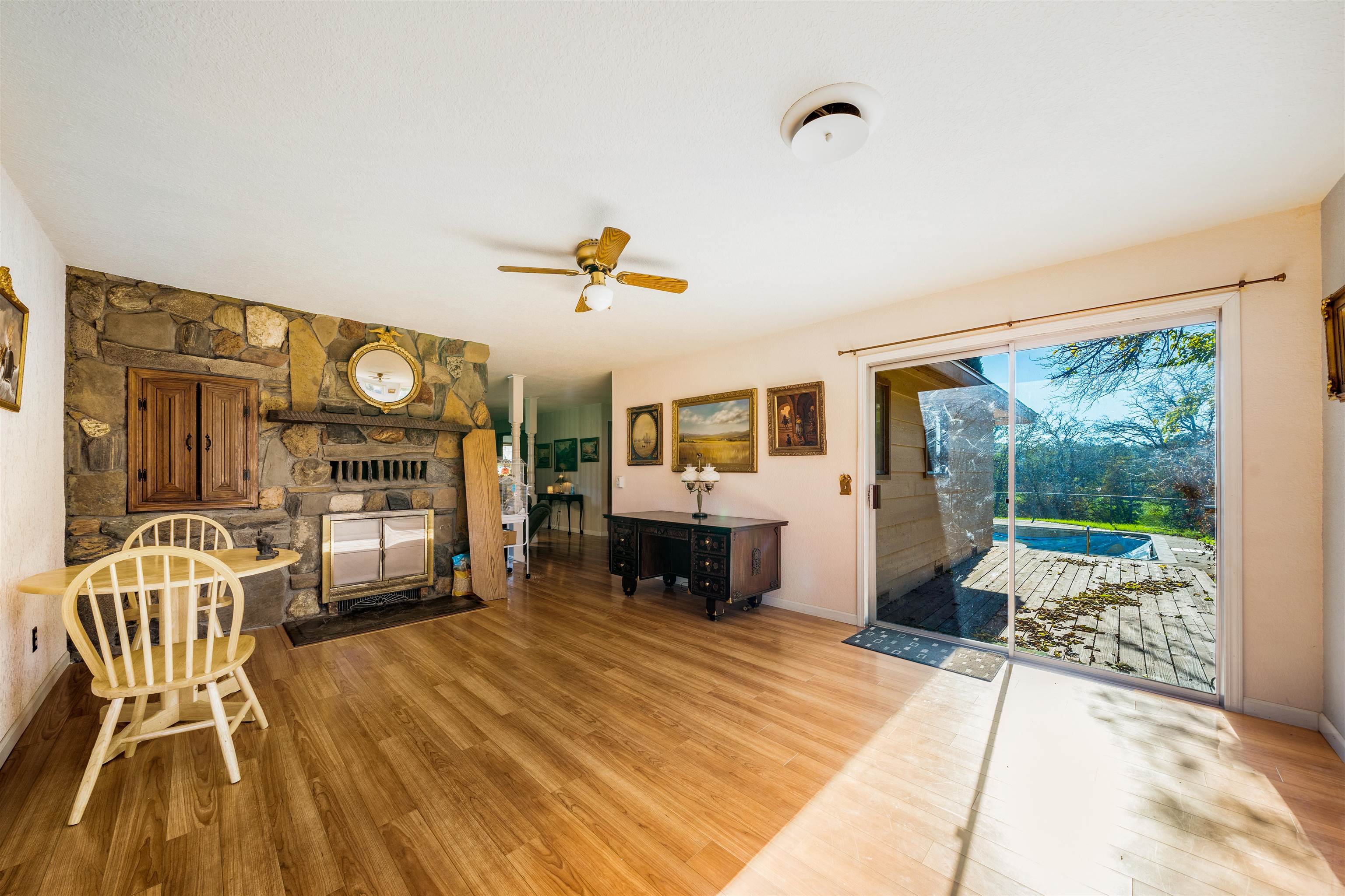19050 Ridge Road Red Bluff, CA 96080 - Photo 10 of 36 a living room with furniture and a fireplace