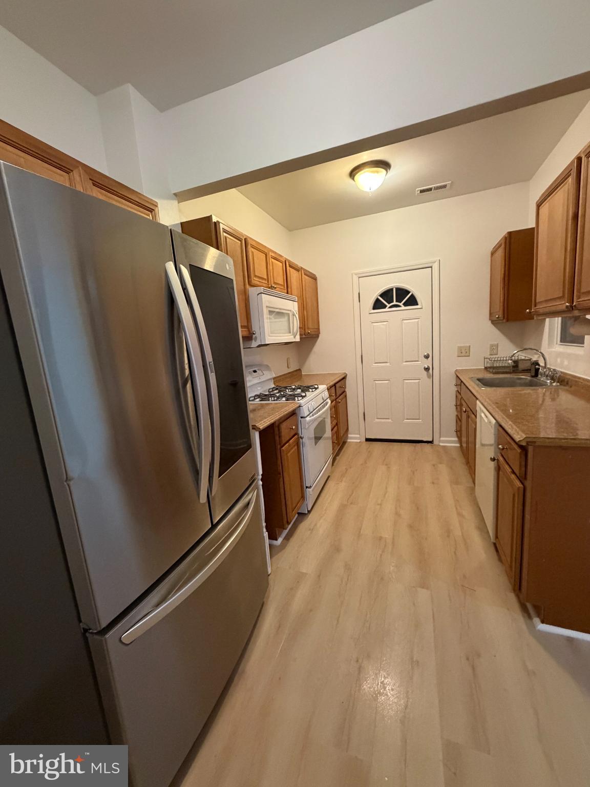 9 Hartford Road Mount Laurel, NJ 08054 - Photo 16 of 37 a kitchen with stainless steel appliances a refrigerator sink and microwave