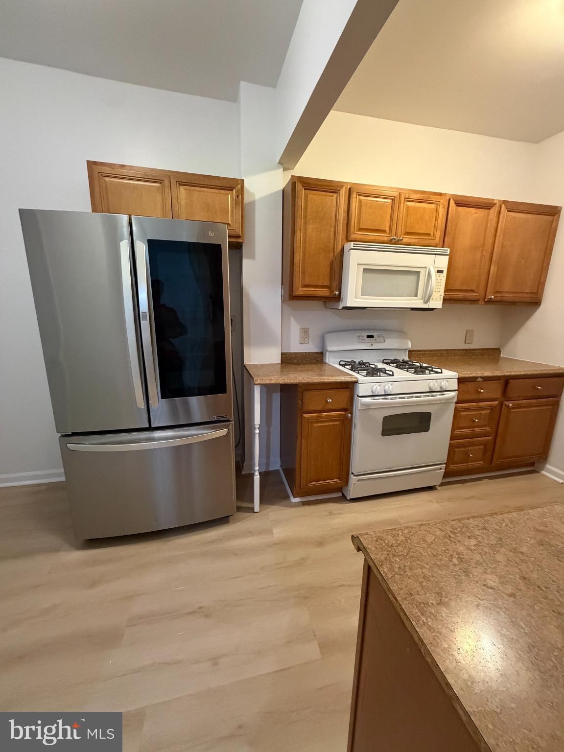 9 Hartford Road Mount Laurel, NJ 08054 - Photo 18 of 37 a kitchen with stainless steel appliances granite countertop a stove a sink and a microwave