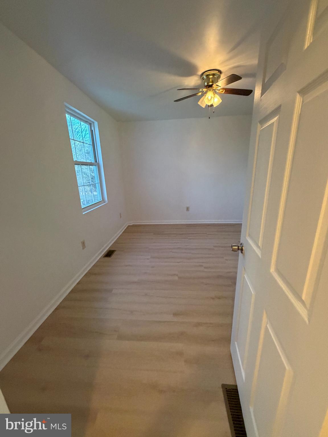 9 Hartford Road Mount Laurel, NJ 08054 - Photo 25 of 37 a view of empty room with window and chandelier fan