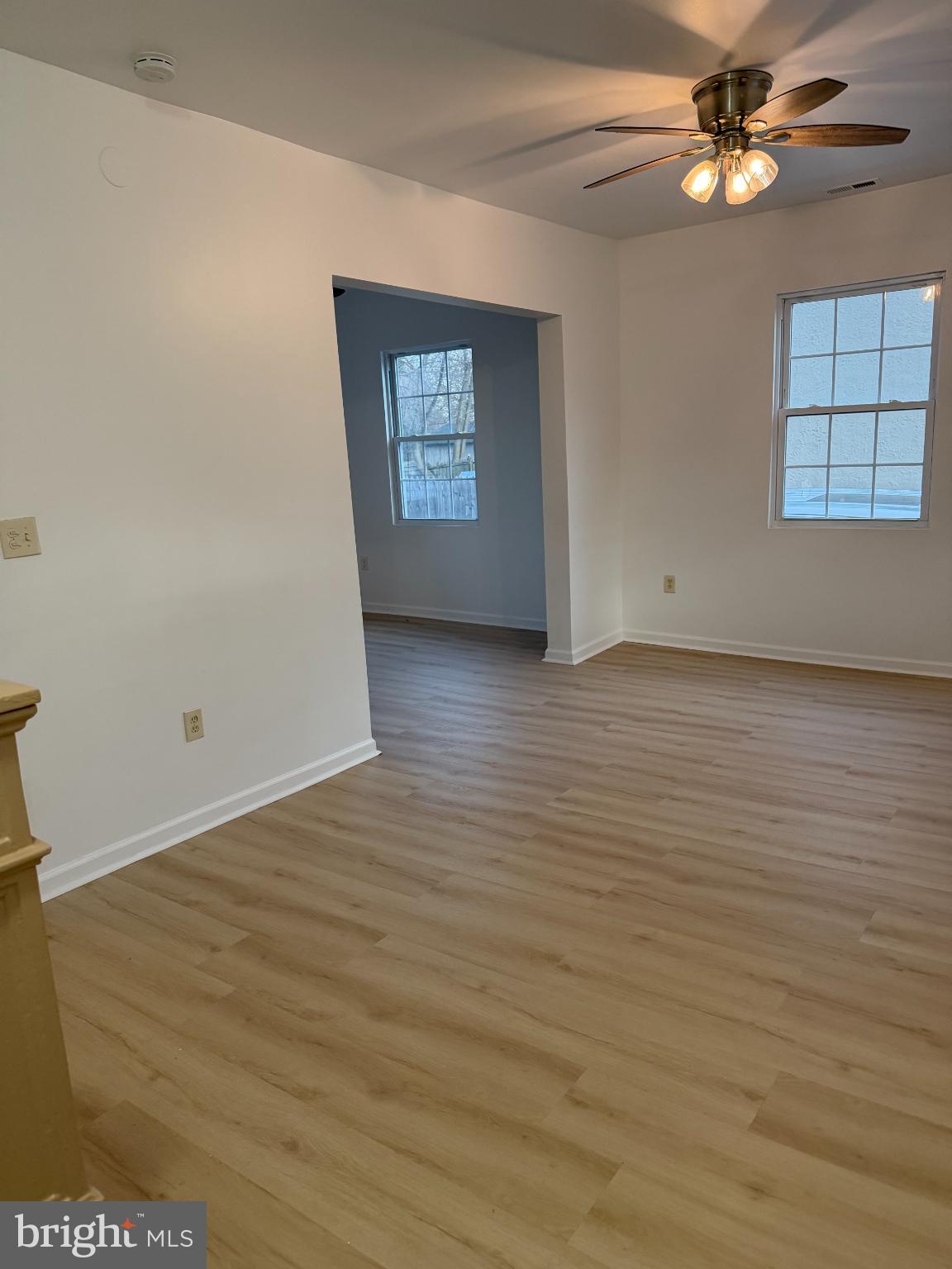 9 Hartford Road Mount Laurel, NJ 08054 - Photo 6 of 37 an empty room with wooden floor chandelier fan and windows