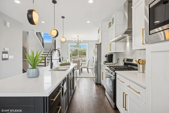 a kitchen with stove and cabinets