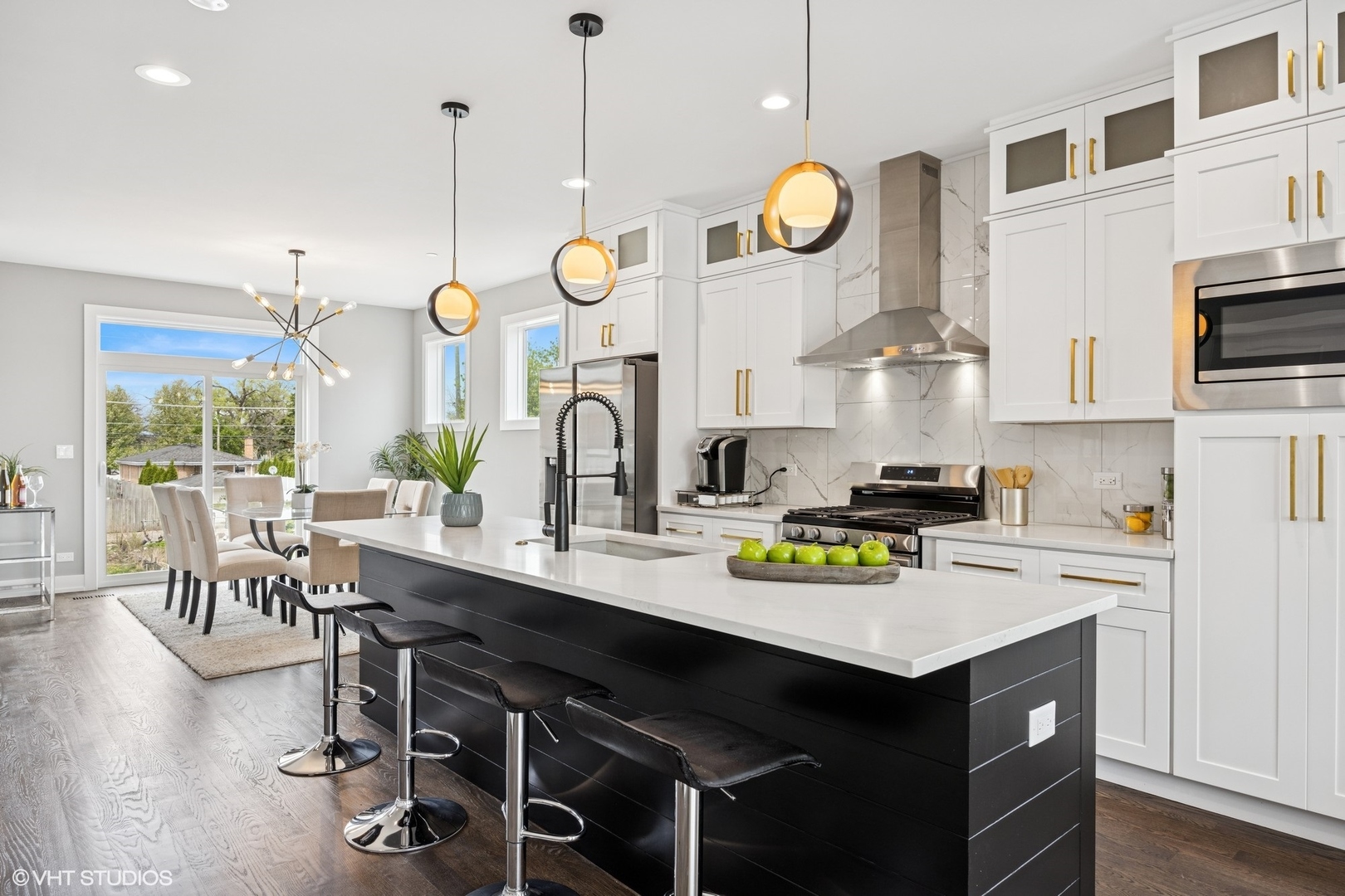 8524 Center Avenue River Grove, IL 60171 - Photo 15 of 38 a kitchen with a sink a stove and chairs